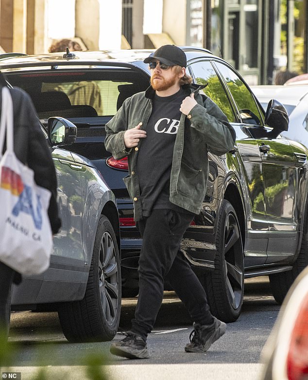 Rupert Grint cut a nonchalant figure as he went for a walk with his partner Georgia Groome in Notting Hill, London, on Wednesday