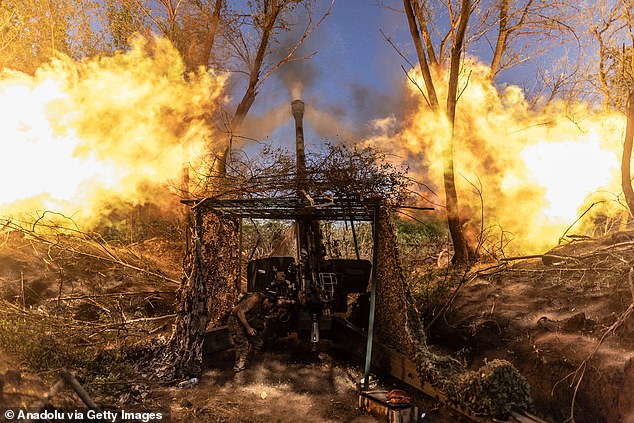 A view of fire after a Ukrainian soldier fires Msta-B artillery at his fighting position towards Liman