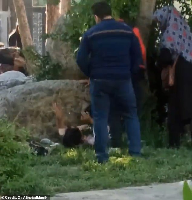 Footage of the incident was captured in what appears to be a busy public park in Iran – reportedly Borujerd – and shared on social media.  The teenager was pushed to the ground by the suspected vice officer.  Her fate was unclear from the footage