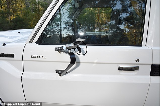 Police believe the side mirror of Russell Hill's car was shot off (photo)