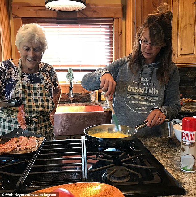 Suzanne Morphew is seen wearing the gray Crested Butte hoodie she was wearing when she was killed, in a photo of her cooking breakfast with her mother-in-law Shirley, at her home in Salida, Colorado in August 2018