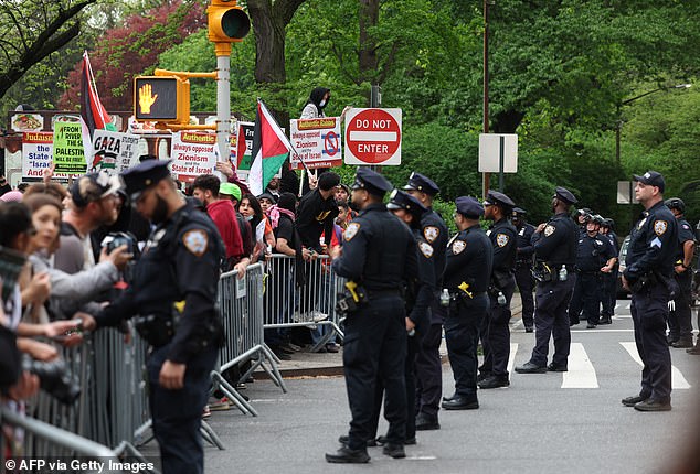 Police are confronted by pro-Palestinian protesters at the Met Gala