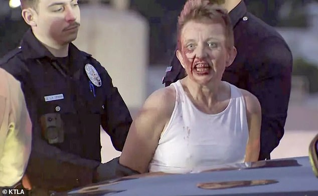 Terrifying footage captured the blood-stained grin of a woman who led Los Angeles police at high speed through oncoming traffic Friday