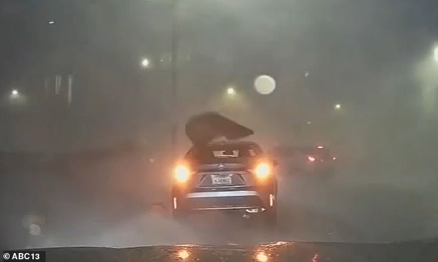 Shocking footage captured the moment heavy storms tore through Houston, Texas last week, ripping a rear window off a Toyota Corolla and lifting it off its rear wheels