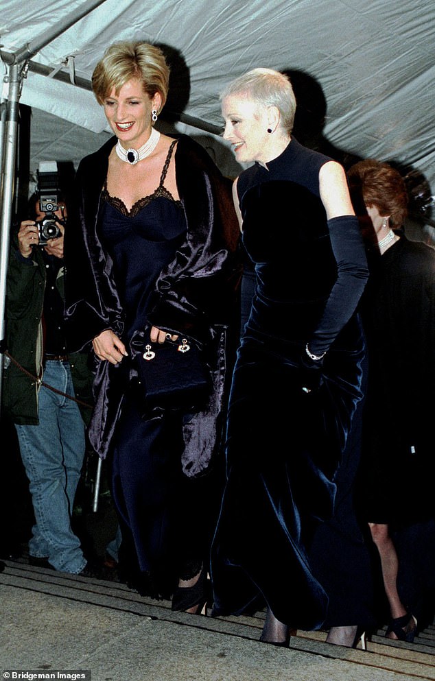 Diana's £10,000 midnight blue dress, trimmed with black lace and worn under a matching velvet opera gown, was the sensation of the evening.  She is pictured here with magazine editor Liz Tilberis