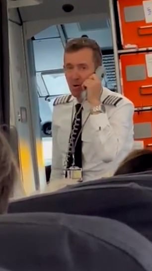 Passengers on a flight from Lisbon to Manchester were left stunned when the pilot (pictured on Sunday) admitted he held up their flight because he 'couldn't give the crew sandwiches'