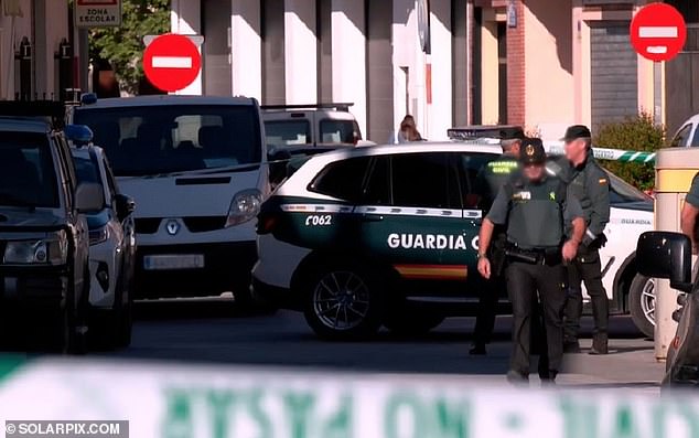 Tragedy has struck a small Spanish town after a pensioner killed his two grandchildren, aged 10 and 13, before shooting himself dead - two months after his wife and daughter died in a car crash while he was driving.  In the photo: the police are seen on the scene in Huetor Tajar
