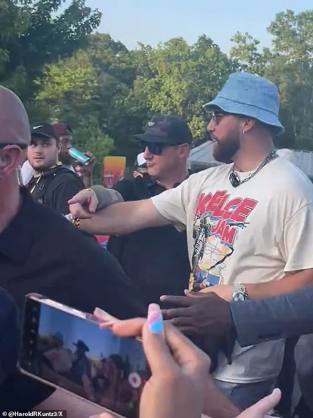 Kelce arrived at his own music festival in a blue bucket hat and a logo shirt for the event
