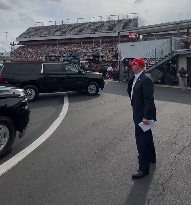 Donald Trump drew some cheers from liberals for a video of him waving at NASCAR's Coca-Cola 600, but was largely embraced by the crowd at the prestigious race Sunday in North Carolina.