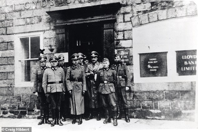 More than 1,000 people died during the Nazi occupation of the islands during World War II.  Pictured: German officers pose outside Lloyds Bank in St Annes, Alderney