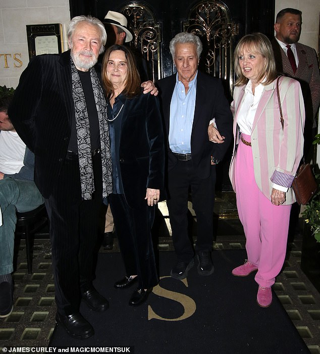 Twiggy, Leigh, 78, Dustin and Lisa, 69, looked friendly as they walked linked together past the luxury restaurant in London