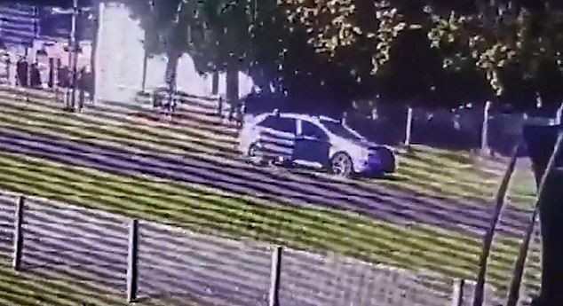 New Zealand police are still searching for a man caught on camera dumping a baby on the road after stealing a car with the child in the backseat (pictured)