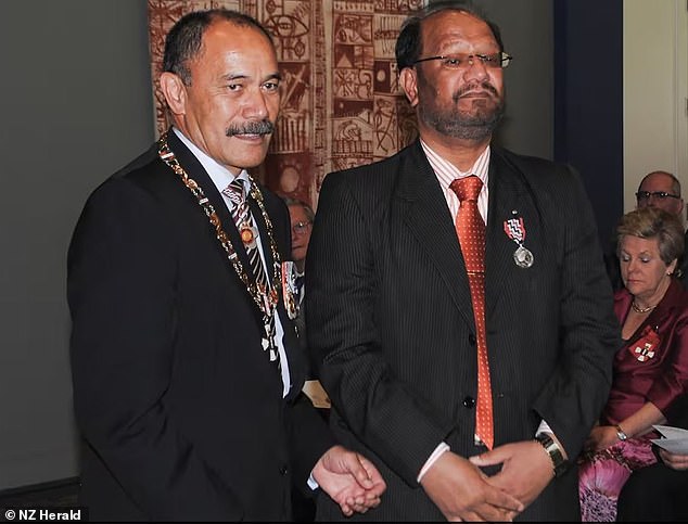 Davinder Singh Rahal (right) ordered to pay almost $1 million after selling a water-damaged house to a young couple (pictured with former Governor General Sir Jerry Mateparae when he was awarded the Queen's Service Medal for services to the Indian community in 2012 )