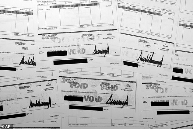 Copies of checks from Donald Trump to attorney Michael Cohen from 2017 shown as exhibits by prosecutors in hush money trial