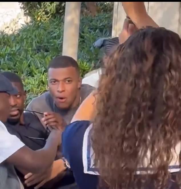 Kylian Mbappé was left speechless when he saw the woman at his table in Cannes waving a French flag