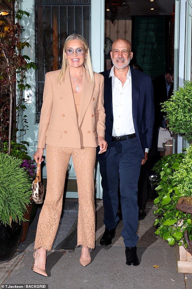 The former Real Housewives of Beverly Hills added inches to her statuesque figure and completed her look with a pair of sky-high beige stilettos