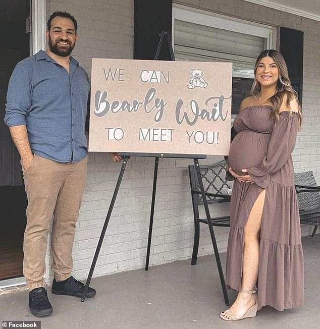The couple posed next to a sign that read 'We can bearly wait to meet you' with a photo of a teddy bear during their elaborate baby shower