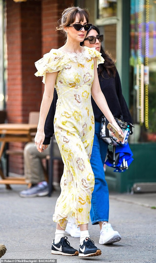 Johnson, 34, was styled in a yellow, white and brown floral maxi dress with an empire waist and butterfly sleeves