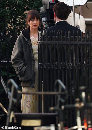 Later on Friday, Dakota and Chris were filmed outside together as the actress donned a warm coat
