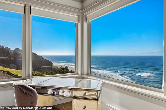 In the study, a desk is pushed up in front of a large window, providing the resident with plenty of natural light