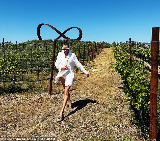 Alessandra took time to visit some wineries in the area and briefly posed while standing in a vineyard