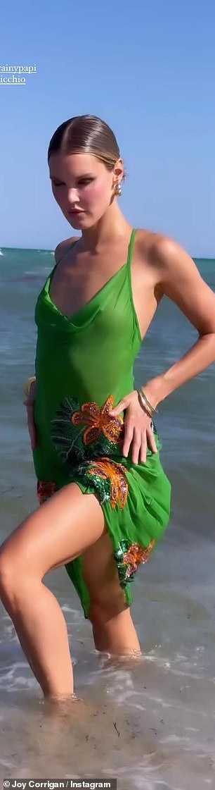 Corrigan then took to her Instagram Stories to share photos of herself turning up the heat in a wet green dress that clung to her frame.