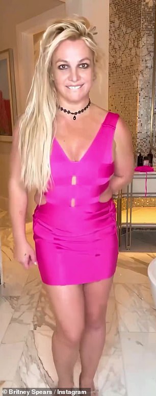 The 42-year-old pop icon wore a bright pink mini bandage dress in a music video