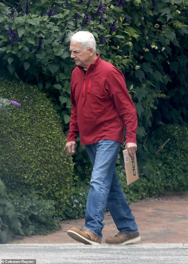 In another set of exclusive photos, Harmon was captured wearing a bright red athletic quarter-zip top as he casually picked up mail at the same address.