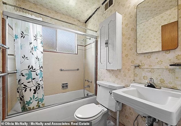 The old house also features a bathroom with dark yellow wallpaper and antique fittings