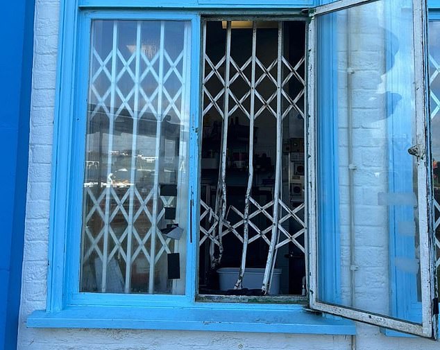 Other photos shared show the extent of the damage to the cafe, including the warped and broken shutters