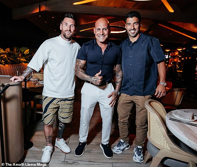 Messi and Suarez posed next to the general manager of the popular Miami restaurant