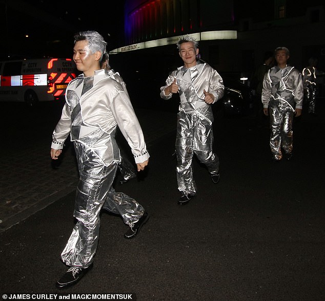 Dance troupe Cyberagent left in their sparkling silver costumes