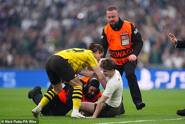 1717271269 11 Champions League final disrupted by THREE pitch invaders as spectators