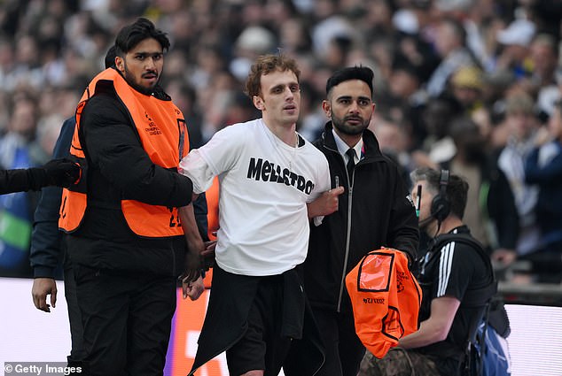 Play was stopped after intruders stormed the field in the first 30 seconds of the match