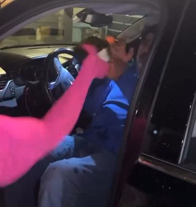 The video featured a woman in a pink sweater pouring liquid on the driver