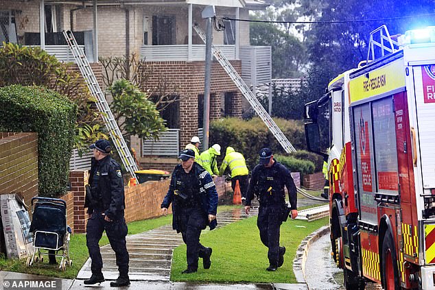 Police have closed access to the street and an increased police presence has been observed in the area since 7.30am on Sunday (photo of police officers on site on Saturday)