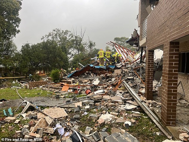 Residents said the explosion was 'huge', while others living in suburbs several kilometers away also felt the quake (pictured the rubble of the collapsed townhouse in Whalan).