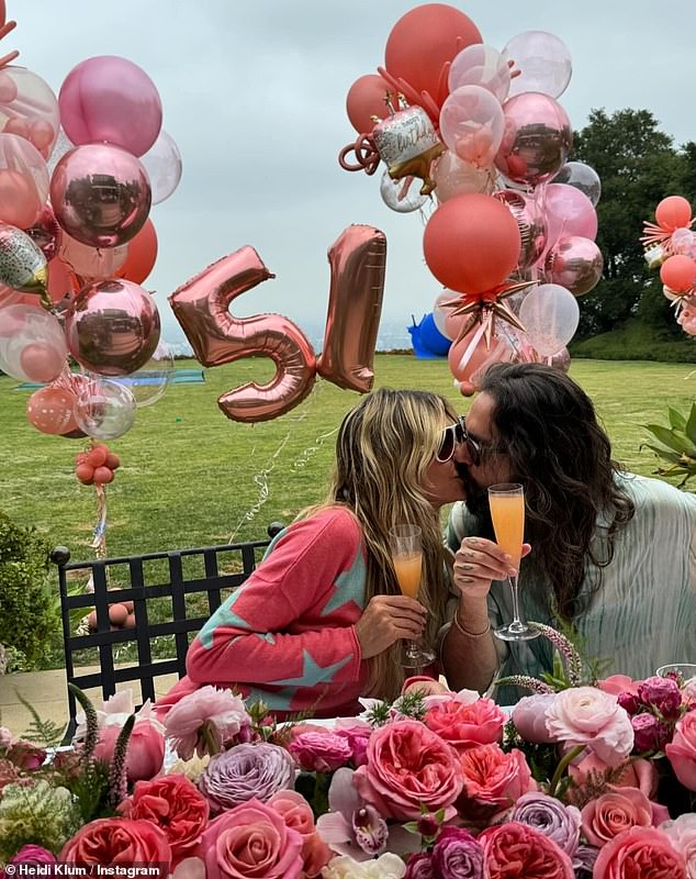 She also uploaded a cheerful snapshot of herself and Tom, the guitarist of German band Tokyo Hotel, sharing a romantic kiss while toasting each other