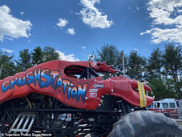 In the footage, a red monster truck with the words 'Crush Station' on the side rolled down the track at the Topsham Fairgrounds.