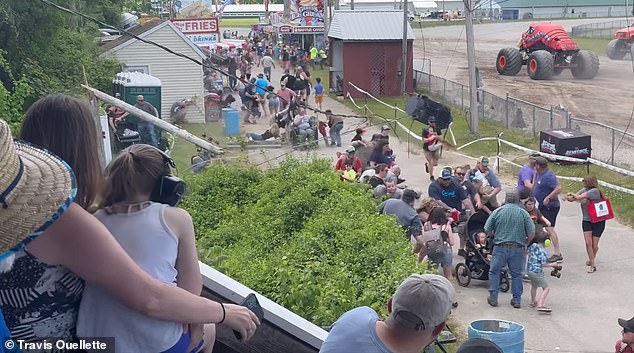 People cringe and duck as the colossal wooden structure slams into the ground.  Then the heavy power line collapses a few centimeters from where the spectators were standing