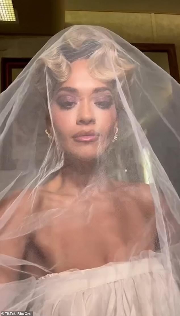 The Hot Right Now singer revealed she wore three different Tom Ford looks for her big day (pictured in a wedding dress for her You Only Love Me music video)