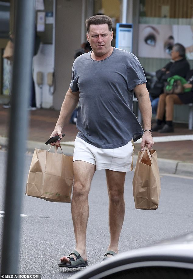 Karl, 49, looked relaxed and comfortable in trendy white shorts from Byron Bay-based resort fashion label Something Very Special