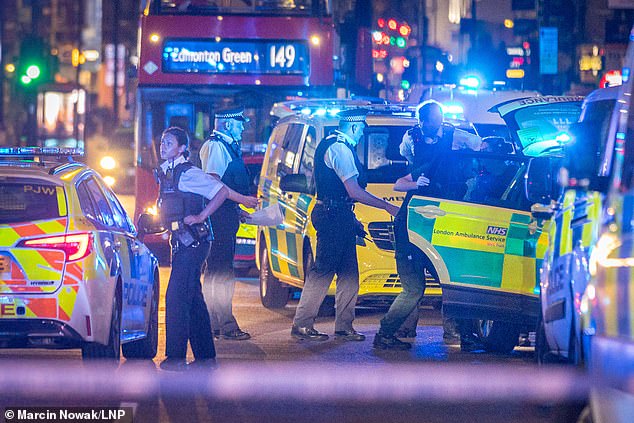 Pictured: Emergency services on scene in Dalston, East London