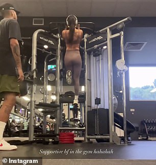 The footage showed the athlete lifting his lover so she could reach the bar before offering words of encouragement