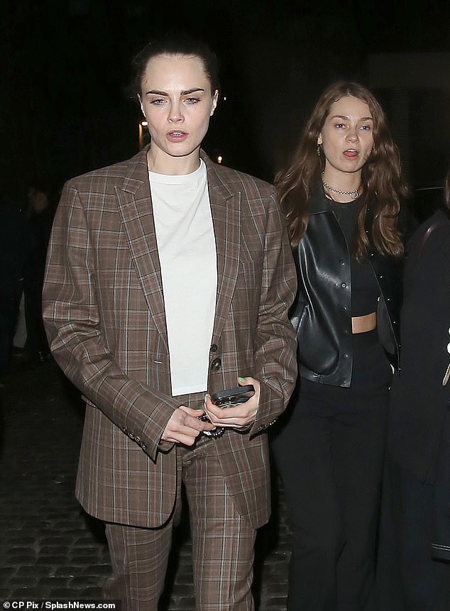 Carawore paired a brown checked suit with a casual plain white T-shirt and a pair of sneakers.  Minke wore beautiful black pants and a black crop top under a leather jacket