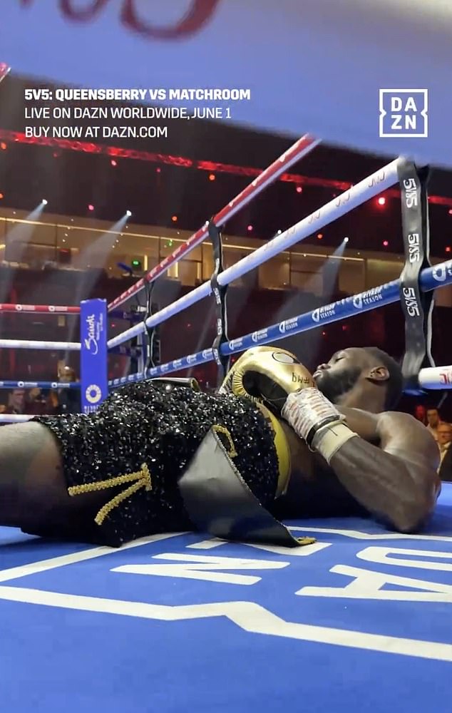 Wilder was seen in the ring on the floor and was forced to use the rope to get back to his feet