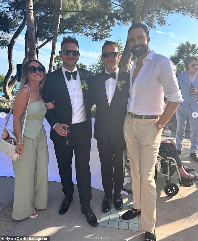 Rylan looked dapper in his beige chinos and white linen shirt as he posed with the groom at the sunny party