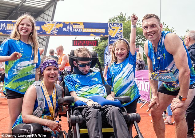 Rob Burrow with his wife Lindsey (who ran the half marathon), daughters Macy and Maya and Kevin Sinfield, pictured a few weeks ago on May 12