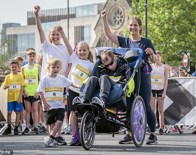 Burrow with his children, (left to right) Macy, Jackson, Maya and his wife Lindsey Burrow (right) at the start of the Arena Group Leeds Mini and Junior Run 2023 in Leeds