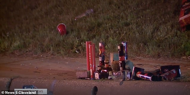 Remaining bottles and cups can be seen near the scene of the early morning shooting on Sunday